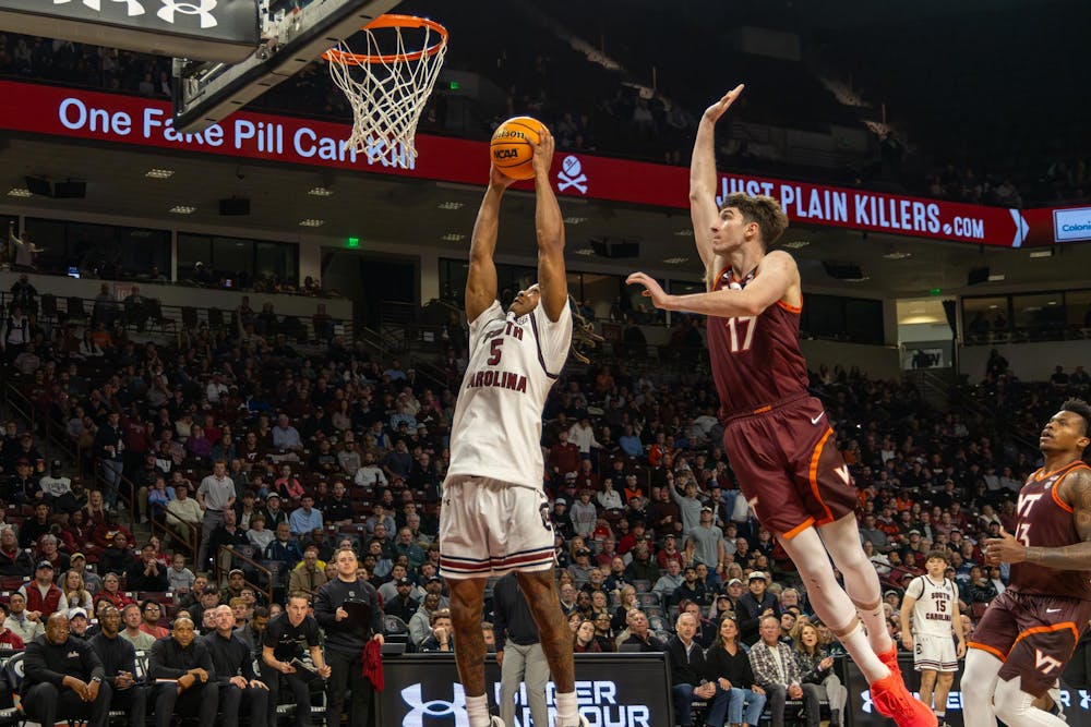 <p>Redshirt senior guard Meechie Johnson attempts to dunk the basketball in front of a Virgina Tech defender on Dec. 2, 2025, at Colonial Life Arena. Johnson scored 18 points in the Gamecocks' 86-83 loss to the Hokies.</p>