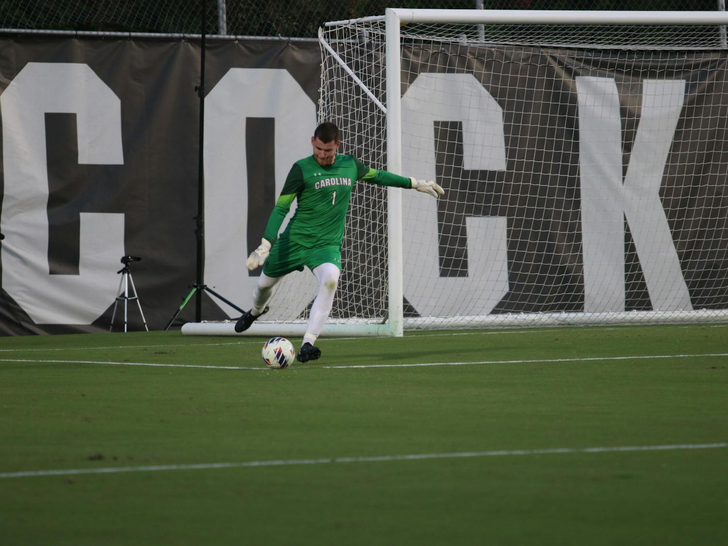 Freshman goalkeeper Ben Alexander kicking the ball back into play during South Carolina's match against Clemson on Sep. 2, 2022.