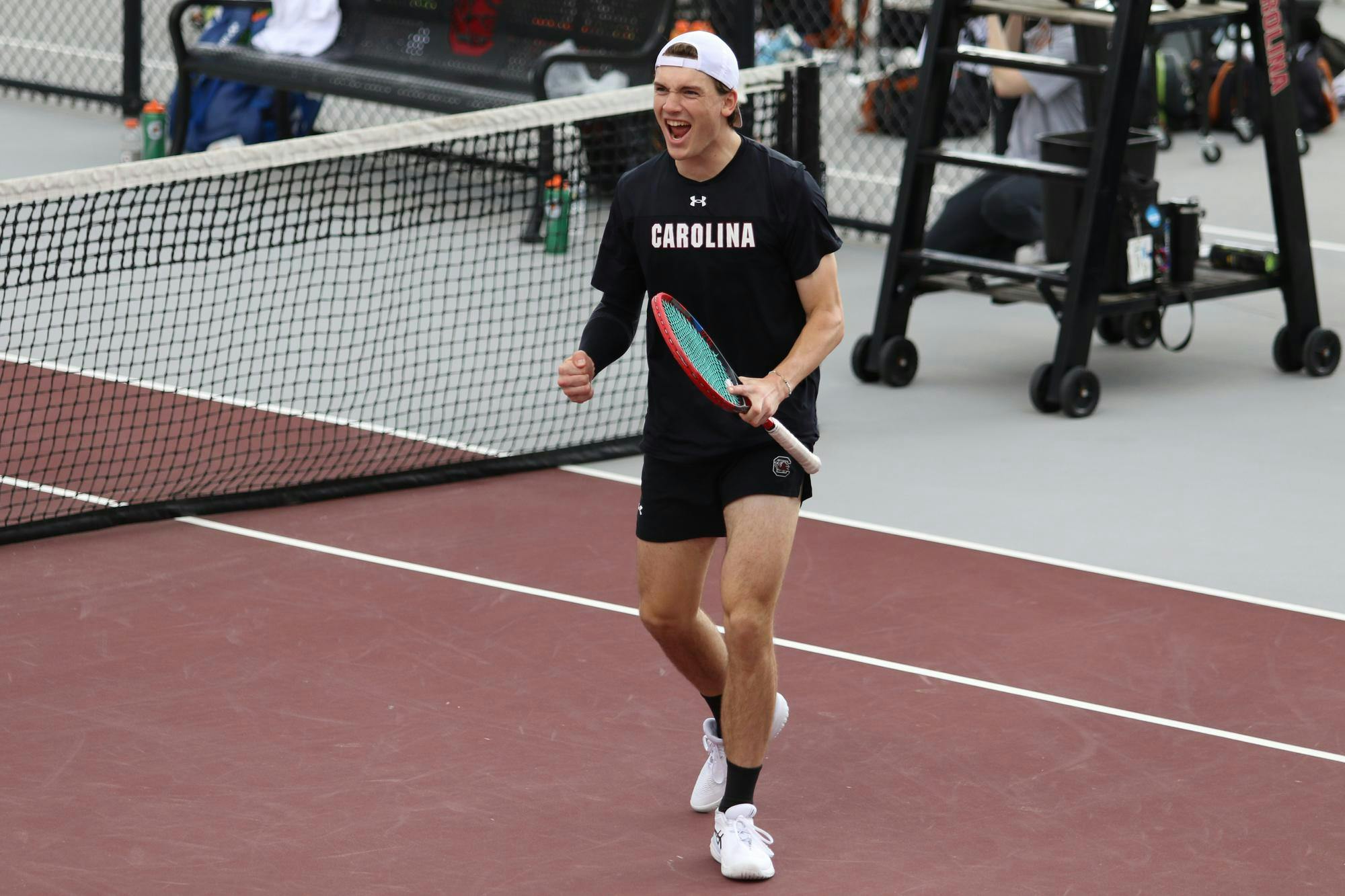 Sophomore Max Stenzer celebrates after he and junior Sean Daryabeigi won a point in doubles against the University of Texas Feb. 27, 2026. The pair won their match against the Longhorns 7-5.
