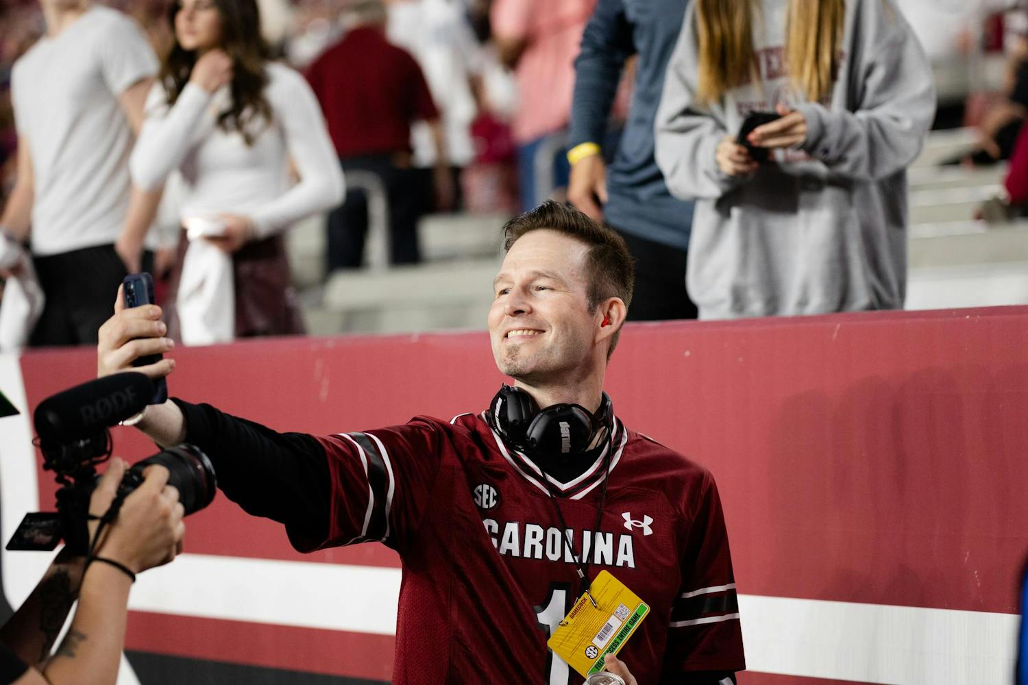 Darude smiles for a picture with a fan while on the sidelines of South Carolina's game against Kentucky. The Gamecocks went on to beat the Wildcats 17-14.
