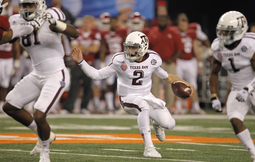 Texas A&amp;M quarterback Johnny Manziel (2) reverses course on a runs in the third quarter against Oklahoma in the AT&amp;T Cotton Bowl game in Cowboys Stadium in Arlington, Texas, on Friday, January 4, 2013. Texas A&amp;M dispatched the Sooners, 41-13. (Rodger Mallison/Fort Worth Star-Telegram/MCT)