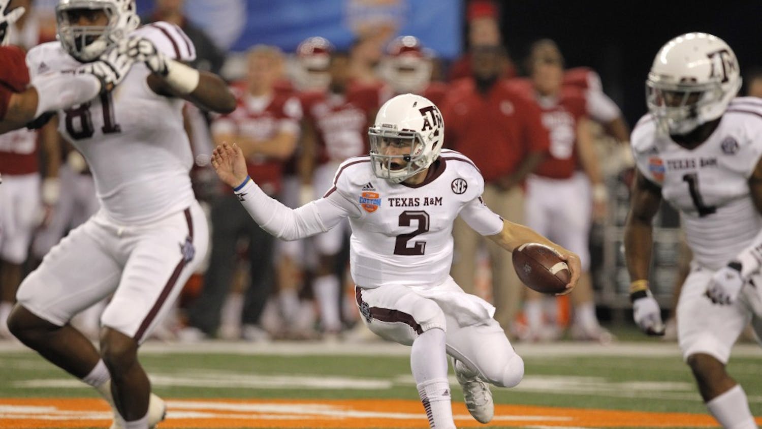 Texas A&amp;M quarterback Johnny Manziel (2) reverses course on a runs in the third quarter against Oklahoma in the AT&amp;T Cotton Bowl game in Cowboys Stadium in Arlington, Texas, on Friday, January 4, 2013. Texas A&amp;M dispatched the Sooners, 41-13. (Rodger Mallison/Fort Worth Star-Telegram/MCT)