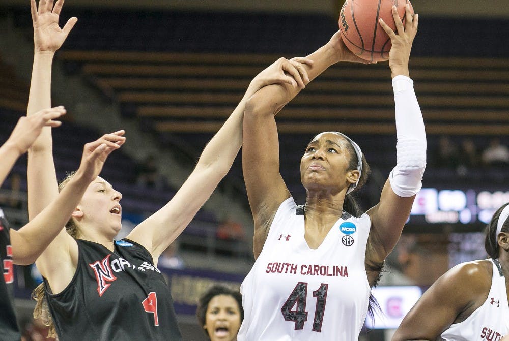 South Carolina&apos;s Alaina Coates (41) gets the rebound and attempts the put back in the second half, but gets fouled by CSU Northridge&apos;s Camille Mahlknecht during the first round of the women&apos;s NCAA Tournament in Seattle on Sunday, March 23, 2014. (Dean Rutz/Seattle Times/MCT)