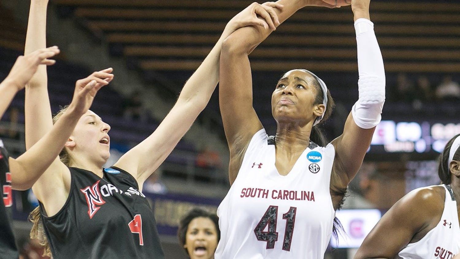 South Carolina's Alaina Coates (41) gets the rebound and attempts the put back in the second half, but gets fouled by CSU Northridge's Camille Mahlknecht during the first round of the women's NCAA Tournament in Seattle on Sunday, March 23, 2014. (Dean Rutz/Seattle Times/MCT)