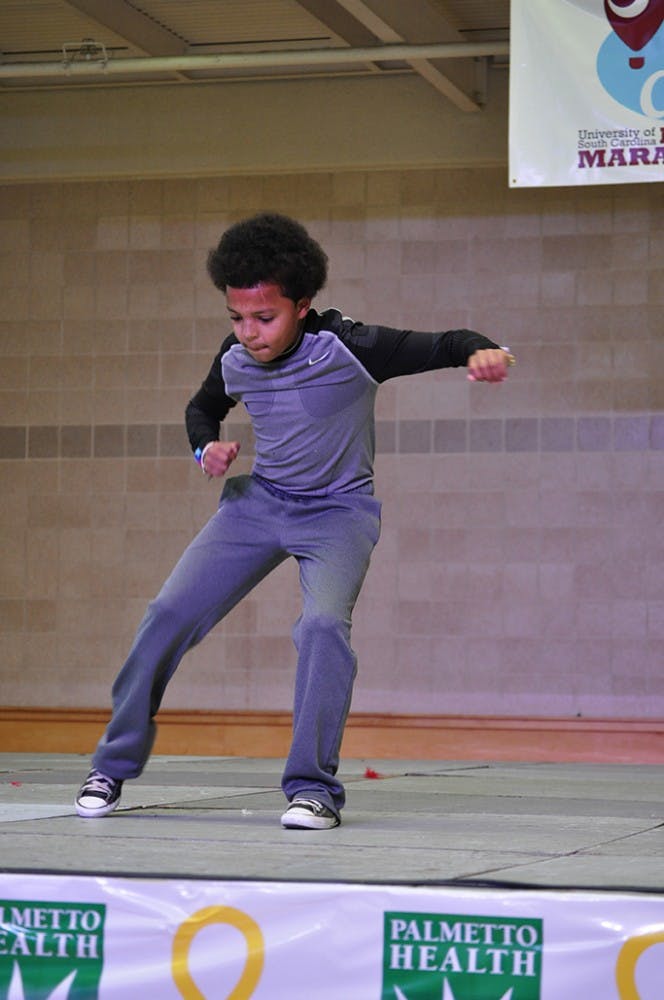 	Miracle child Keldon Hemingway performed a dance routine of his own at Dance Marathon, drawing cheers from all those present. Keldon was one of several miracle children who shared their stories at Dance Marathon.
Brian Almond/The Daily Gamecock