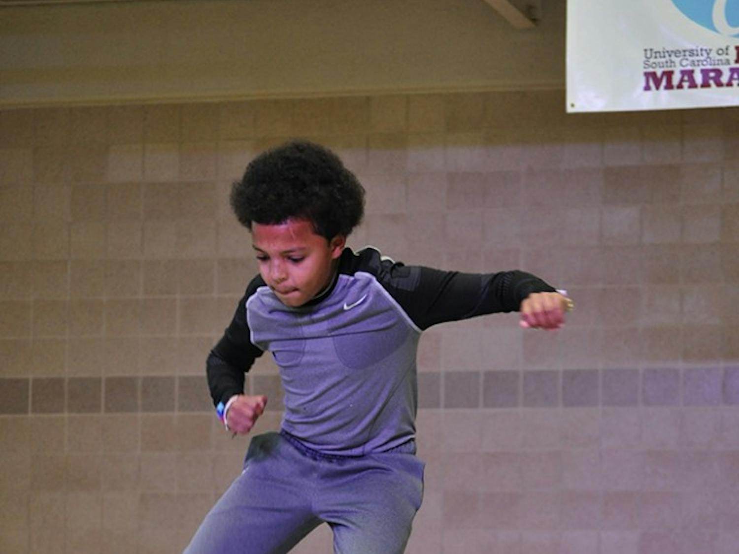 	Miracle child Keldon Hemingway performed a dance routine of his own at Dance Marathon, drawing cheers from all those present. Keldon was one of several miracle children who shared their stories at Dance Marathon.
Brian Almond/The Daily Gamecock