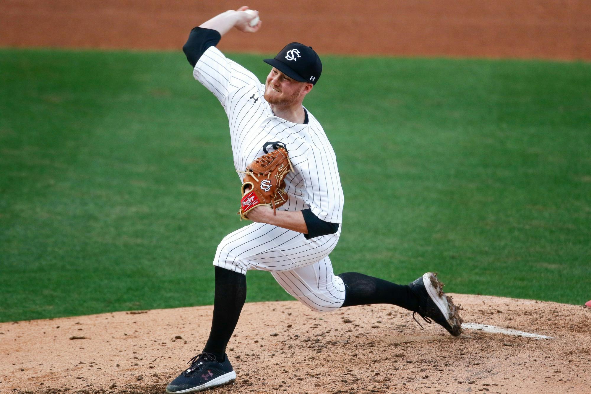 &nbsp;Redshirt junior righthanded pitcher Thomas Farr pitches the ball toward the opposing team's batter.&nbsp;