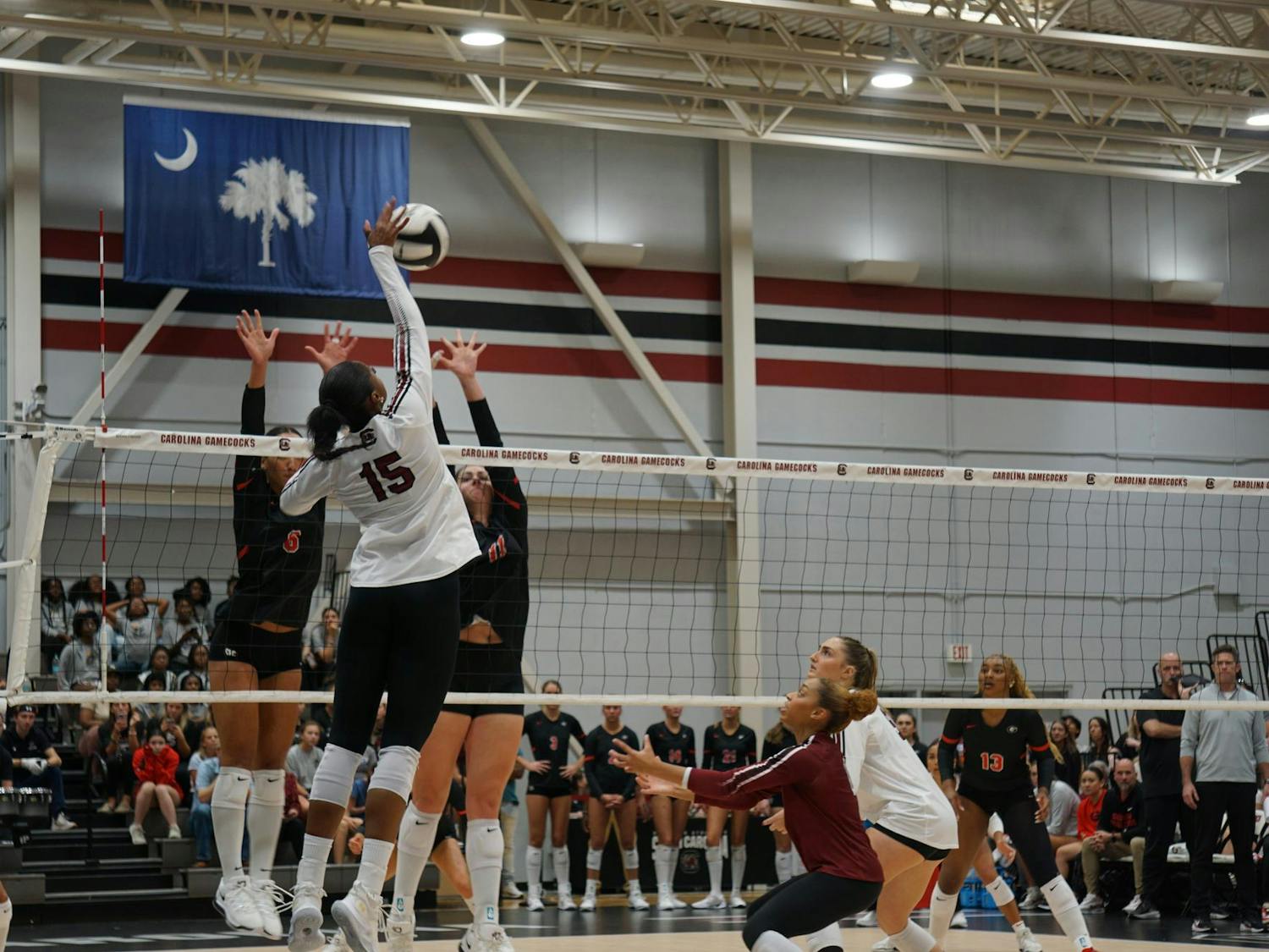 Junior outside hitter Nia Hall jumps to spike the ball against Georgia players at the Carolina Volleyball Center on Oct. 5, 2025. Hall now has 177 kills on the season.