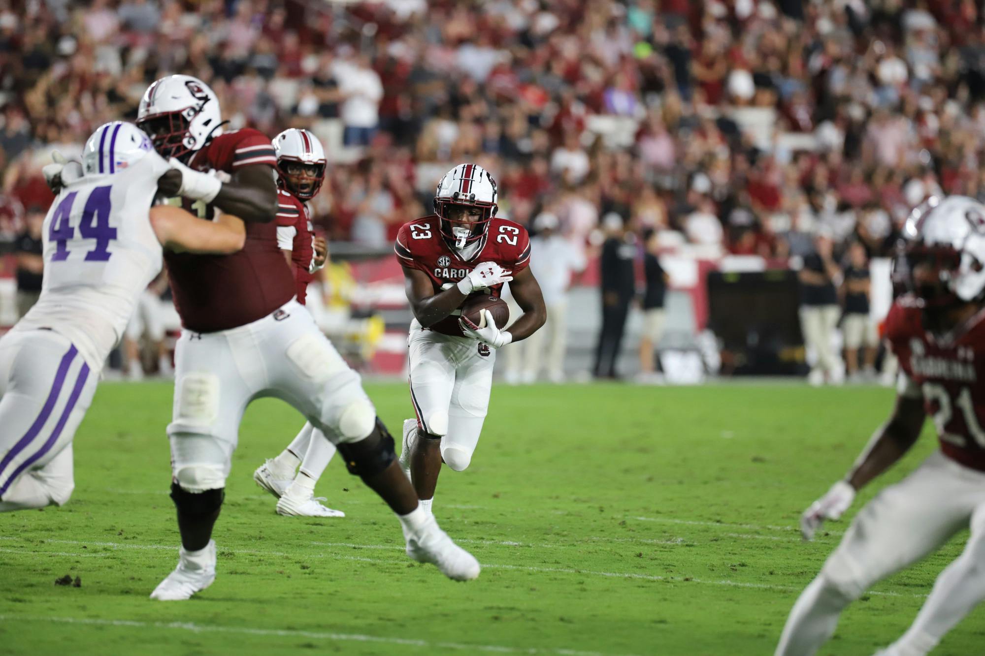Freshman running back Djay Braswell searches for a hole late in South Carolina's 47-21 win over Furman. The win was the Gamecocks' first of the season in its first home game since defeating Tennessee in late 2022.