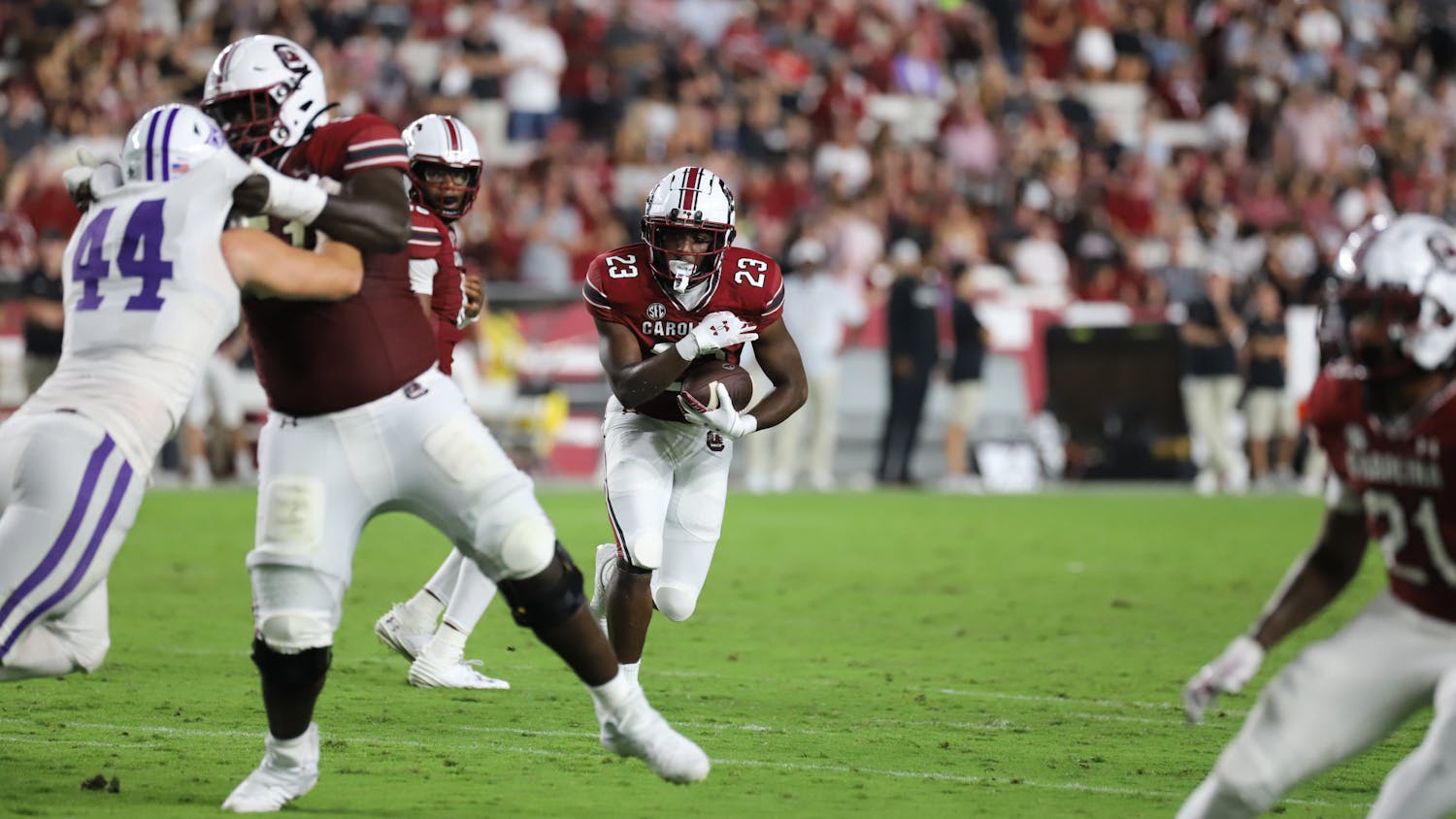 Freshman running back Djay Braswell searches for a hole late in South Carolina's 47-21 win over Furman. The win was the Gamecocks' first of the season in its first home game since defeating Tennessee in late 2022.