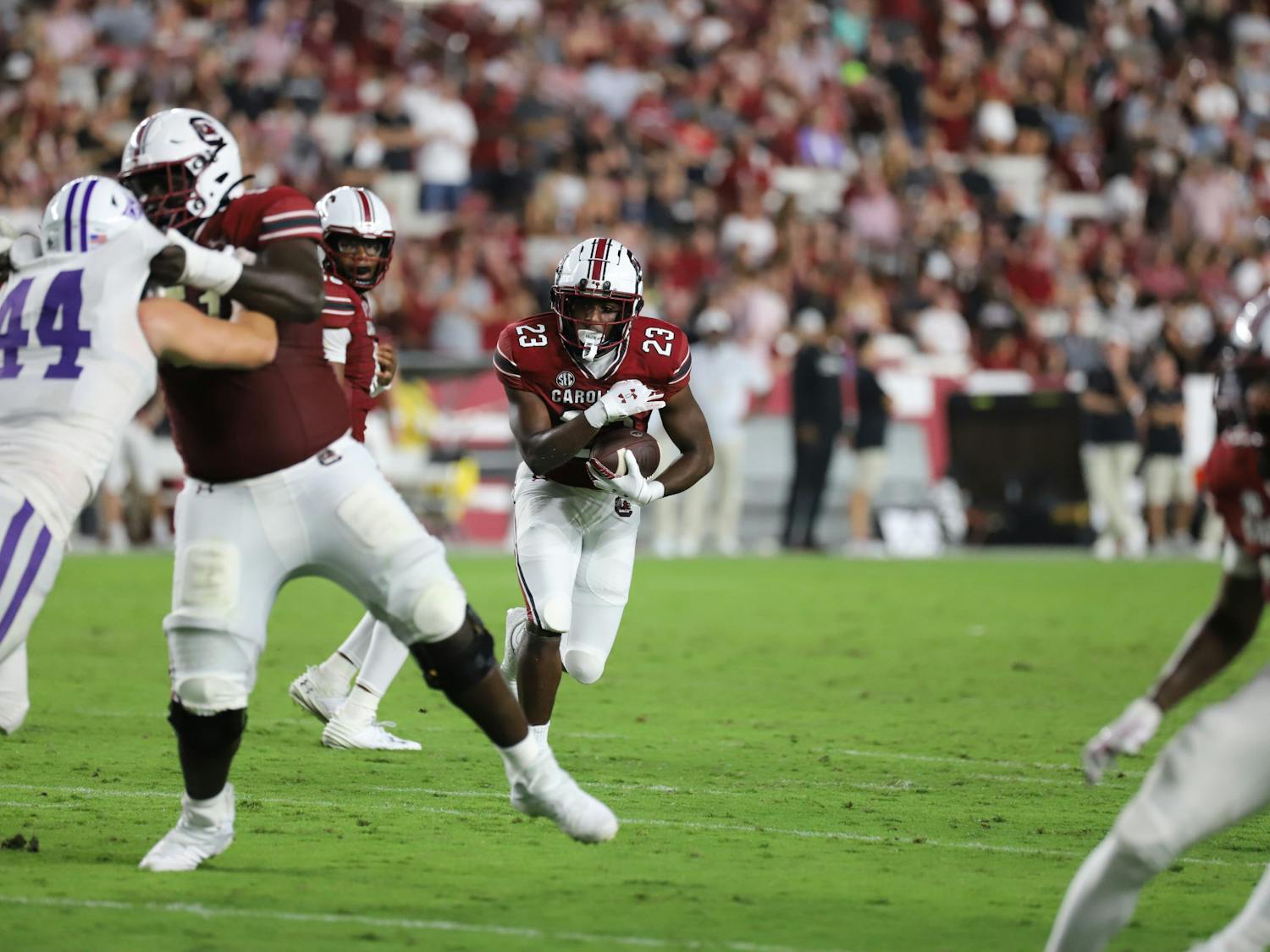 Freshman running back Djay Braswell searches for a hole late in South Carolina's 47-21 win over Furman. The win was the Gamecocks' first of the season in its first home game since defeating Tennessee in late 2022.