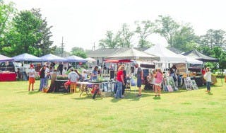 A view of the Blythewood Farmers Market, which has multiple booths set up.