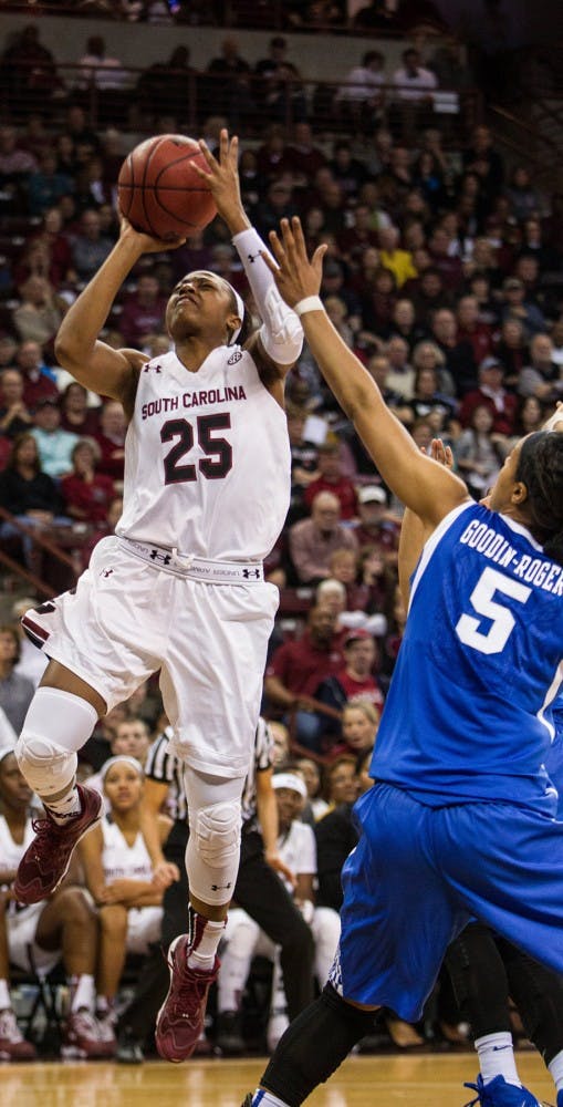 South Carolina&apos;s Tiffany Mitchell (25) shoots over Kentucky&apos;s Kyvin Goodin-Rogers (5) during the first half at the Colonial Life Arena in Columbia, S.C., on Sunday, Jan. 11. 2015. South Carolina won, 68-60. (Tracy Glantz/The State/TNS)