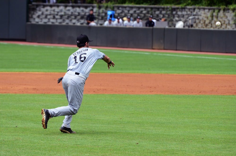 Third baseman Chase Vergason throws a ball in to first base.
