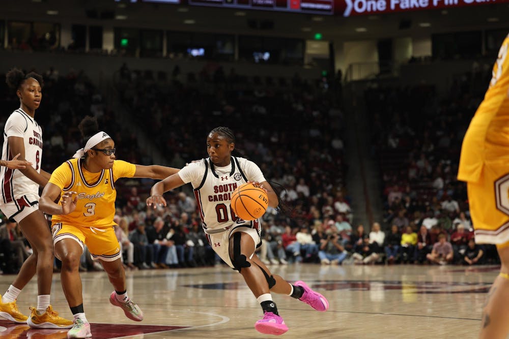 <p>Senior guard Ta'Niya Latson goes straight to the basket against a Winthrop defender at Colonial Life Arena on Nov. 19, 2025</p>