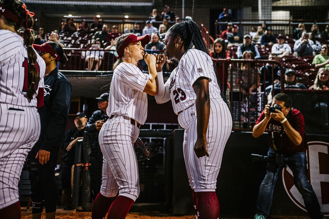 Sophomore infielder Brooke Blankenship (on left) and senior pitcher Donnie Gobourne (on right) celebrate with each other during player introductions at the South Carolina vs. College of Charleston game on February 15, 2023. The Gamecocks beat the Cougars 8-0.&nbsp;
