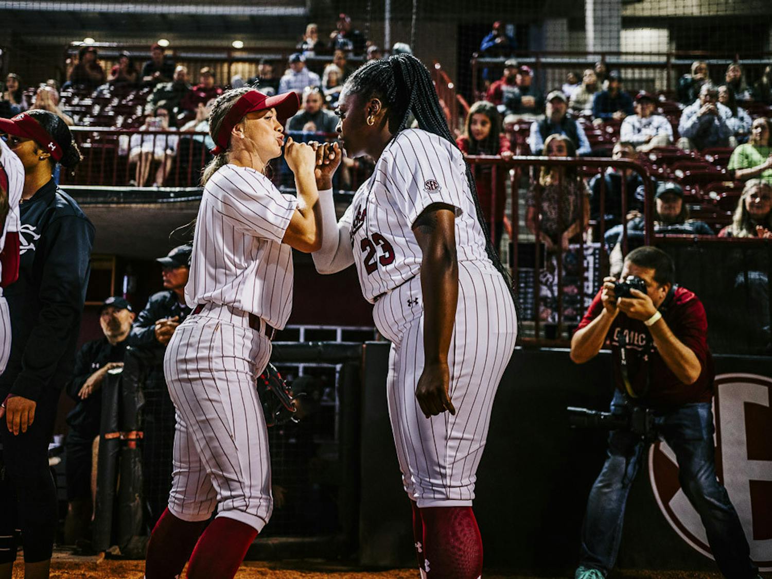 Sophomore infielder Brooke Blankenship (on left) and senior pitcher Donnie Gobourne (on right) celebrate with each other during player introductions at the South Carolina vs. College of Charleston game on February 15, 2023. The Gamecocks beat the Cougars 8-0.&nbsp;