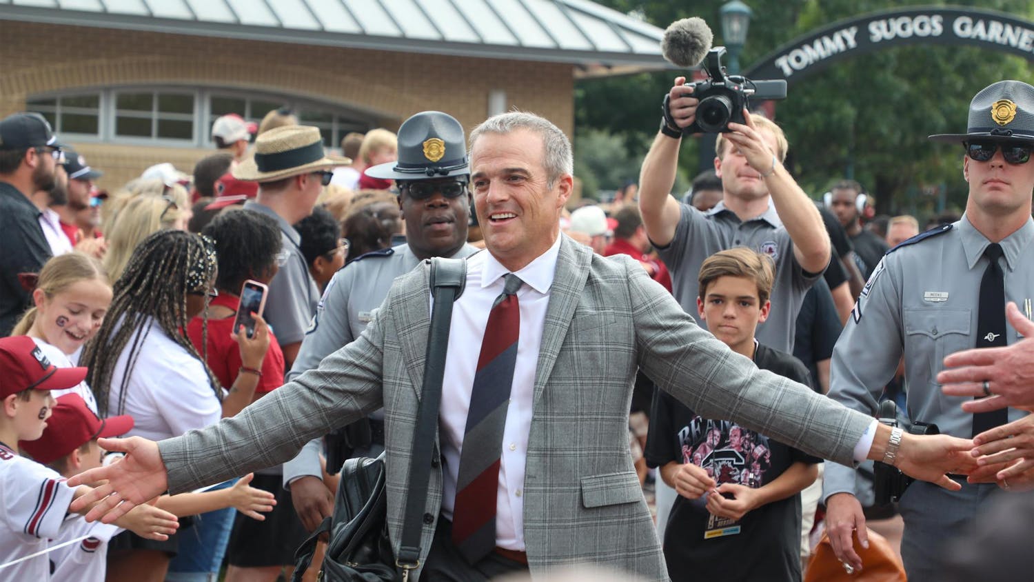 FILE — South Carolina football head coach Shane Beamer walks down a pathway surrounded by fans during Gamecock Walk on Sept. 6, 2025. The Gamecocks ended their 2025 season with a 4-8 record.