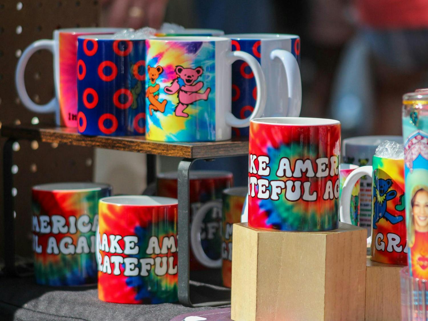 Grateful Dead-themed mugs sit on a JerryFest vendor's table on Oct. 6, 2024. JerryFest was started to commemorate the life and art of Jerry Garcia.