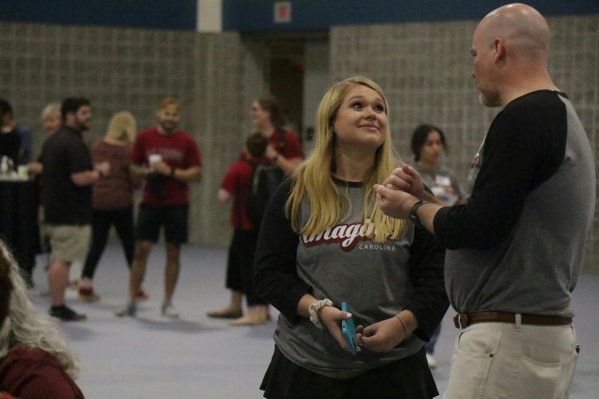 FILE—University of South Carolina Student Body President Reedy Newton talks with staff at the Imagine Carolina event in the Columbia Metropolitan Convention Center on Sept. 11, 2022.&nbsp;