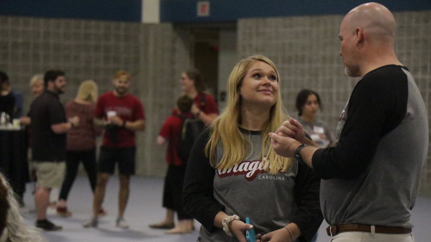 FILE—University of South Carolina Student Body President Reedy Newton talks with staff at the Imagine Carolina event in the Columbia Metropolitan Convention Center on Sept. 11, 2022.&nbsp;