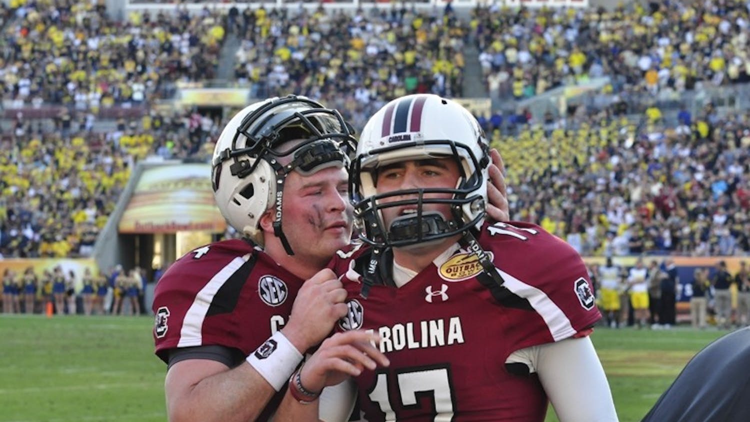 Junior quarterback Connor Shaw (left) was pulled from the game in the middle of USC’s final possession. Sophomore Dylan Thompson (right) threw the game-winning pass.
