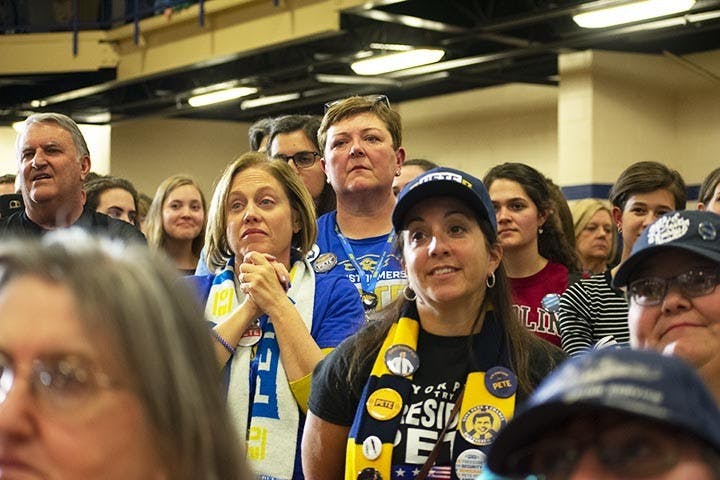 Volunteers and attendees watch Pete Buttigieg speak the Get Out the Vote town hall in Seven Oaks Park on Feb. 29, 2020.