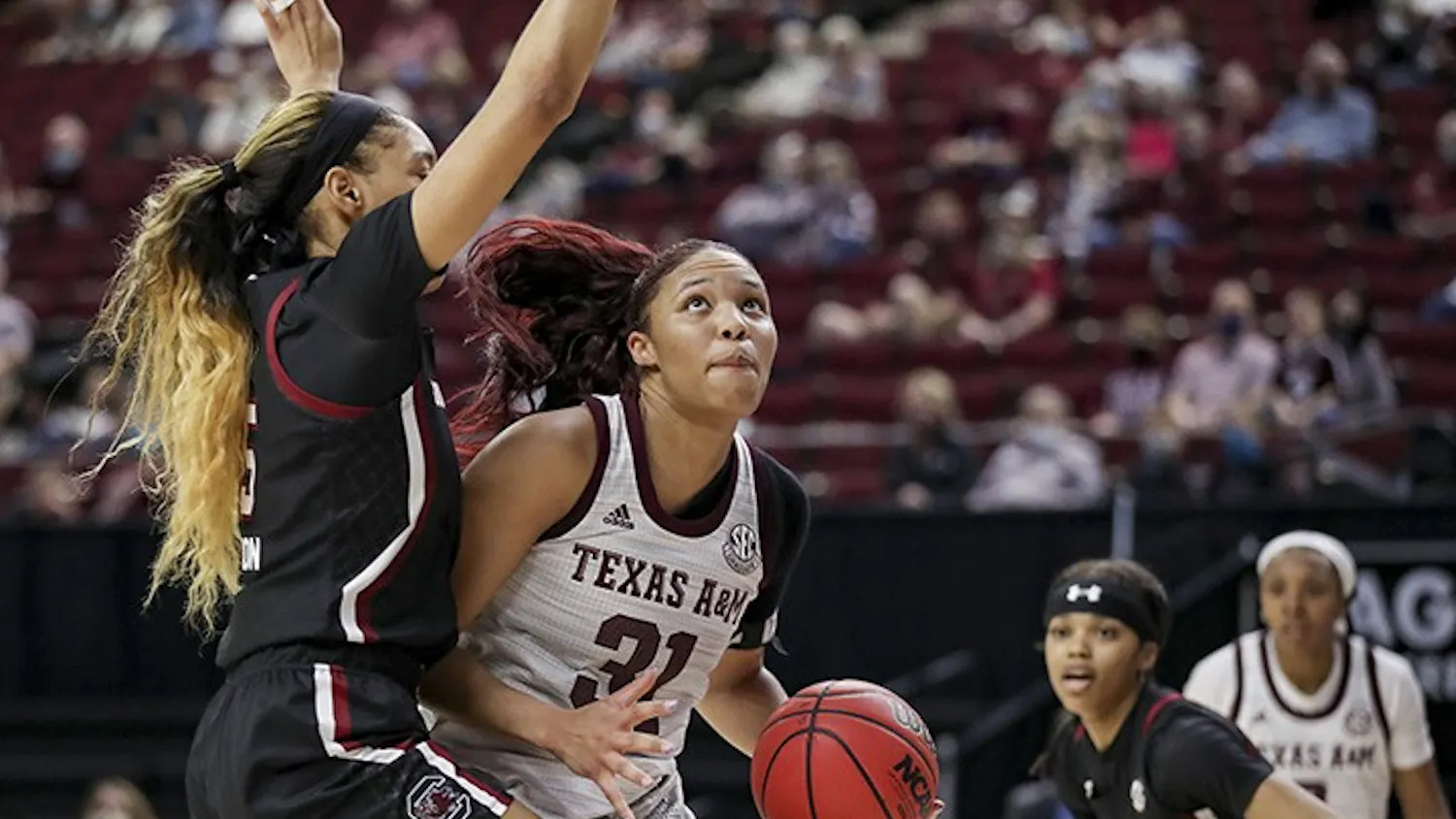Junior forward Victaria Saxton blocks Texas A&M’s senior forward N'dea Jones. South Carolina lost to Texas A&M 65-57.