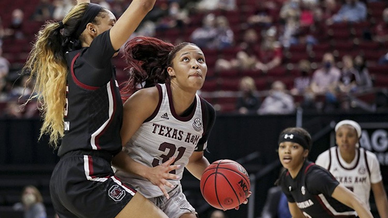 Junior forward Victaria Saxton blocks Texas A&M’s senior forward N'dea Jones. South Carolina lost to Texas A&M 65-57.