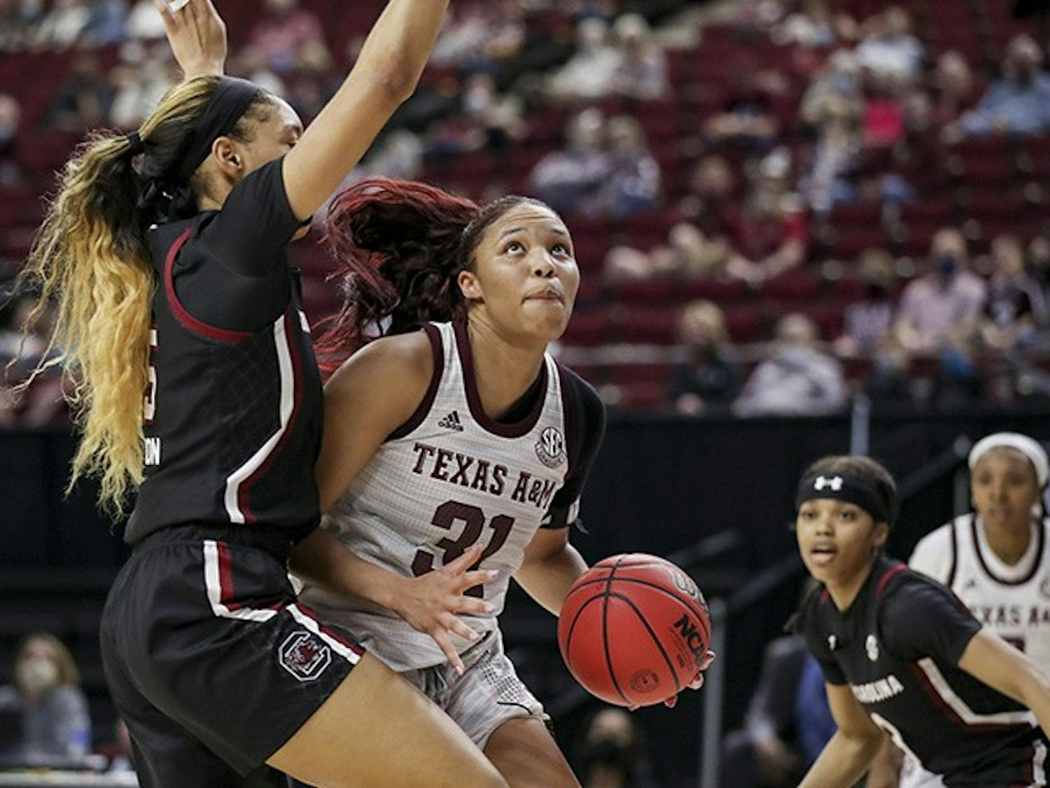 Junior forward Victaria Saxton blocks Texas A&M’s senior forward N'dea Jones. South Carolina lost to Texas A&M 65-57.