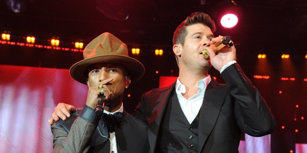 LOS ANGELES, CA - JANUARY 25:  Pharrell Williams and Robin Thicke perform onstage during the 56th annual GRAMMY Awards  Pre-GRAMMY Gala and Salute to Industry Icons honoring  Lucian Grainge at The Beverly Hilton on January 25, 2014 in Los Angeles, California.  (Photo by Kevin Mazur/WireImage)