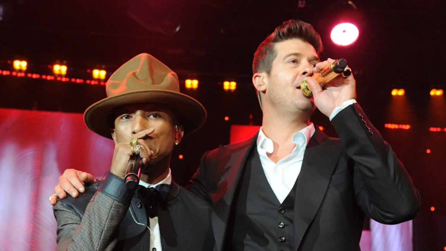 LOS ANGELES, CA - JANUARY 25: Pharrell Williams and Robin Thicke perform onstage during the 56th annual GRAMMY Awards Pre-GRAMMY Gala and Salute to Industry Icons honoring Lucian Grainge at The Beverly Hilton on January 25, 2014 in Los Angeles, California. (Photo by Kevin Mazur/WireImage)