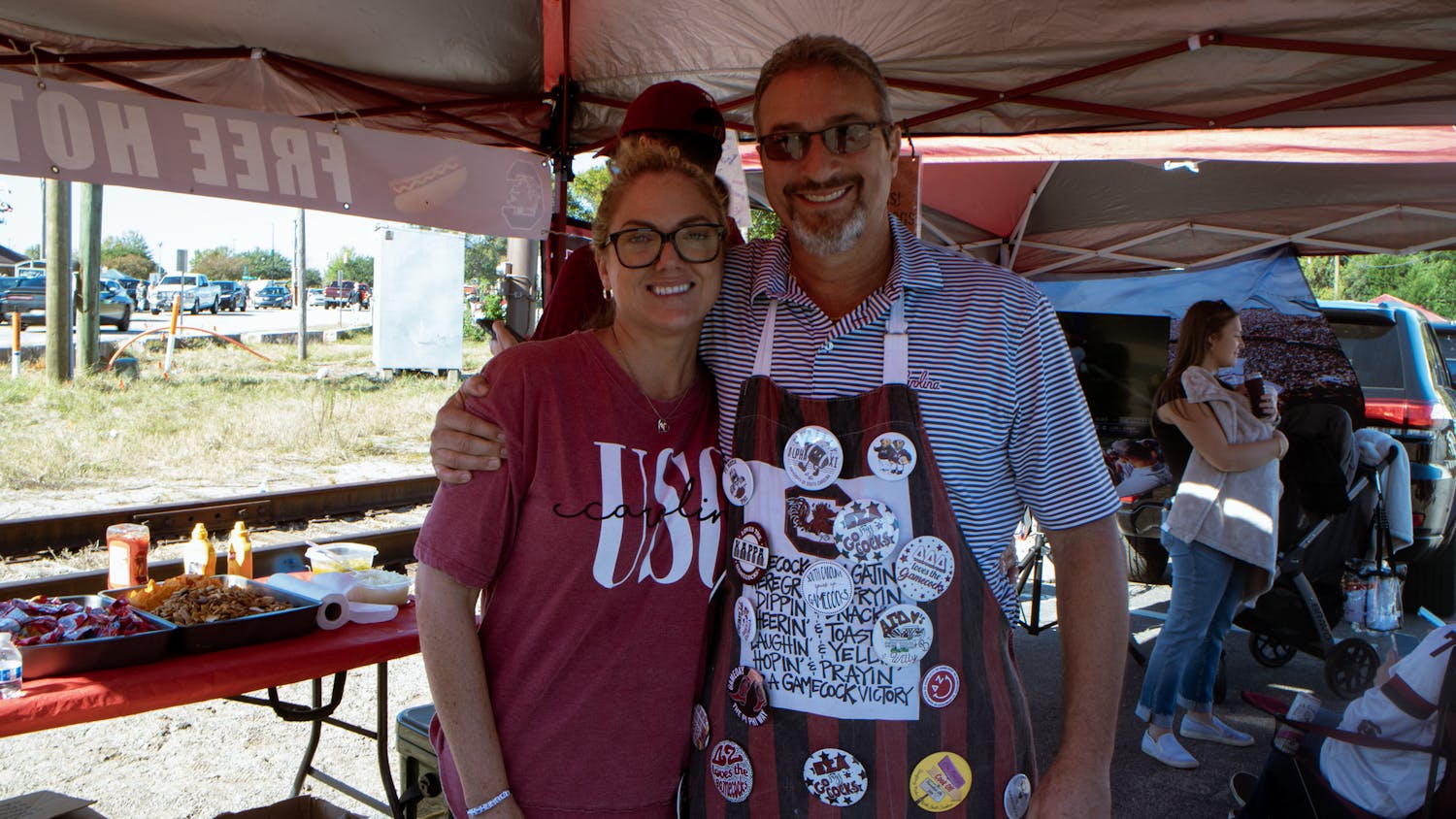 Chris and Dominique Crawford at their tailgate spot near the fraternity lots outside of Williams-Brice Stadium. The Crawfords hand out free hotdogs to students before every South Carolina home game.