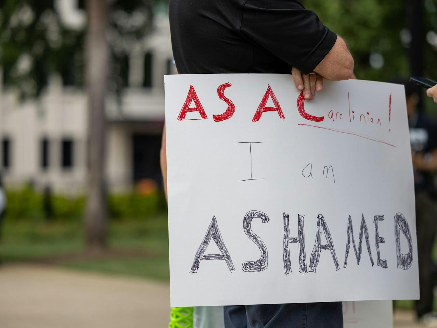 A sign reading 'As a Carolinian I am ashamed' is displayed at the South Carolina Statehouse on Sept. 18, 2024. A peaceful rally called 'Hate is Not Welcomed in South Carolina' was held ahead of the Uncensored America event.