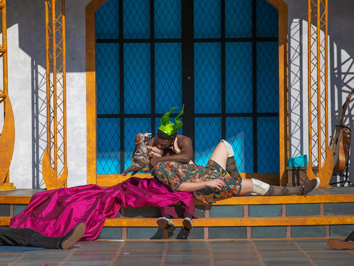 Characters Oberon (right) and Bottom (left), portrayed by second-year theater student Rowland Marshall and third-year theatre and English student Michael Williamson kiss during a scene in "A Midsummer Night's Dream" on Oct. 9, 2022. &nbsp;USC Department of Theatre and Dance held the play from October 2 to 9, 2022.&nbsp;