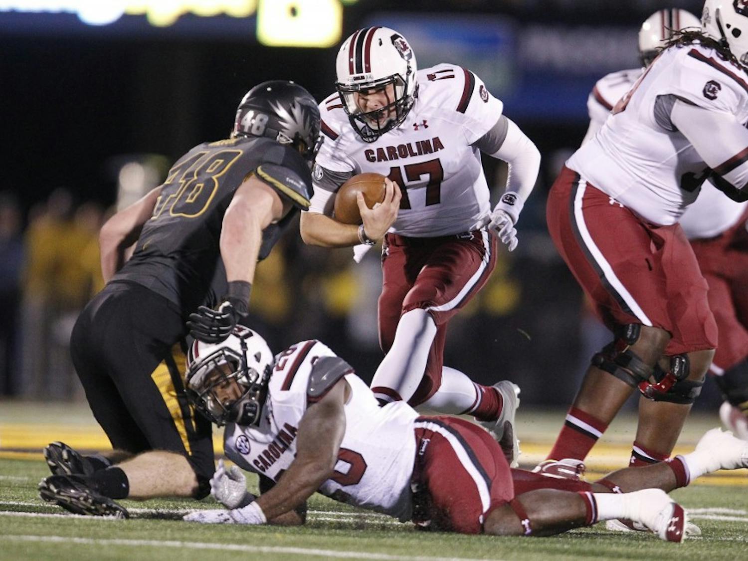 South Carolina Gamecocks quarterback Dylan Thompson (17) runs for a first down during the first quarter against Missouri at Memorial Stadium's Faurot Field in Columbia, Missouri, on Saturday, October 26, 2013. (Gerry Melendez/The State/MCT)
