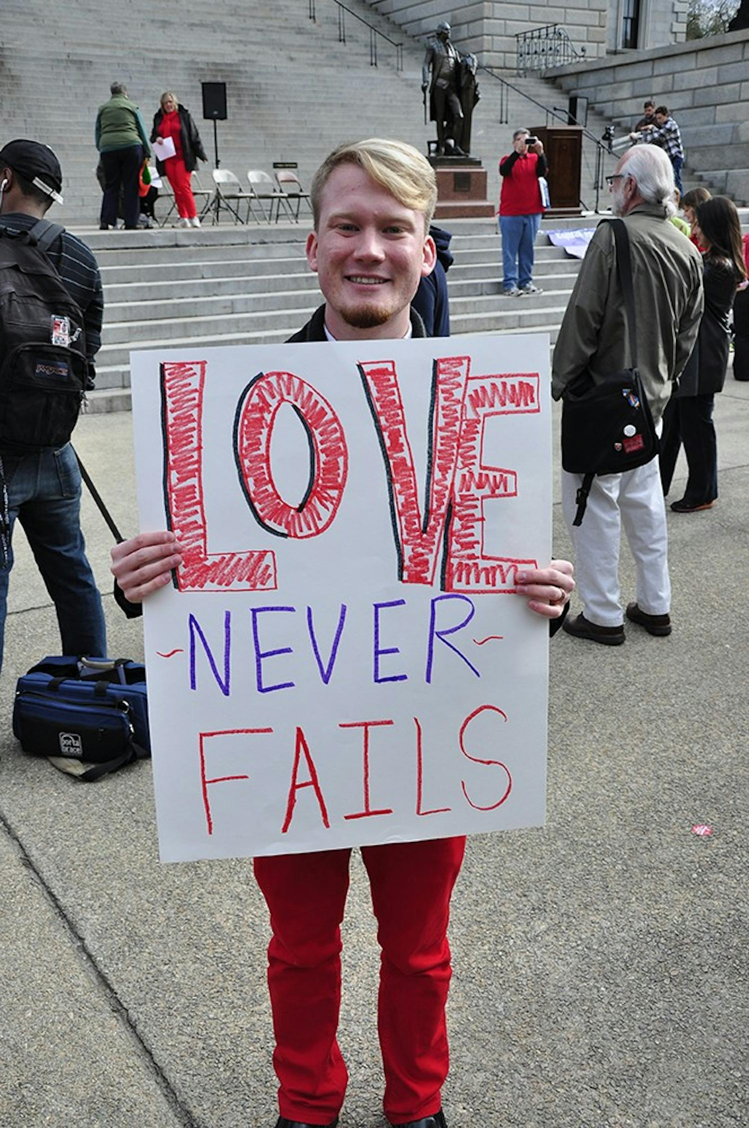 Former Bisexual, Gay, Lesbian, Straight Alliance president Zac Baker joins other protesters at the United for Marriage Equality rally on Tuesday.