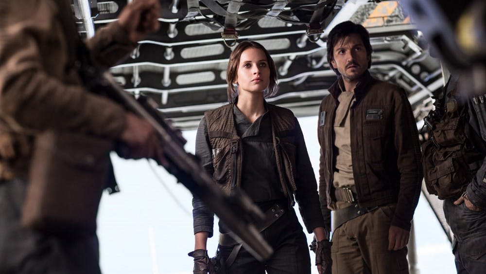Felicity Jones as Jyn Erso and Diego Luna as Cassian Andor in the film 