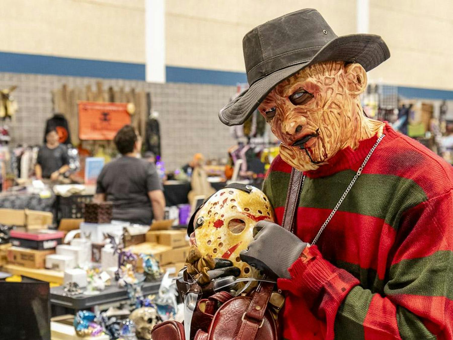 Marcus Cunningham, dressed up as Freddy Krueger, poses with a Jason Voorhees Mask in reference to the "Freddy vs. Jason" franchise during the first day of the South Carolina Horror Convention on Sept. 16, 2023. Cunningham said he plans on returning on Sept. 17, 2023, dressed up as Jason Voorhees, taking three hours prior to prepare the costume.