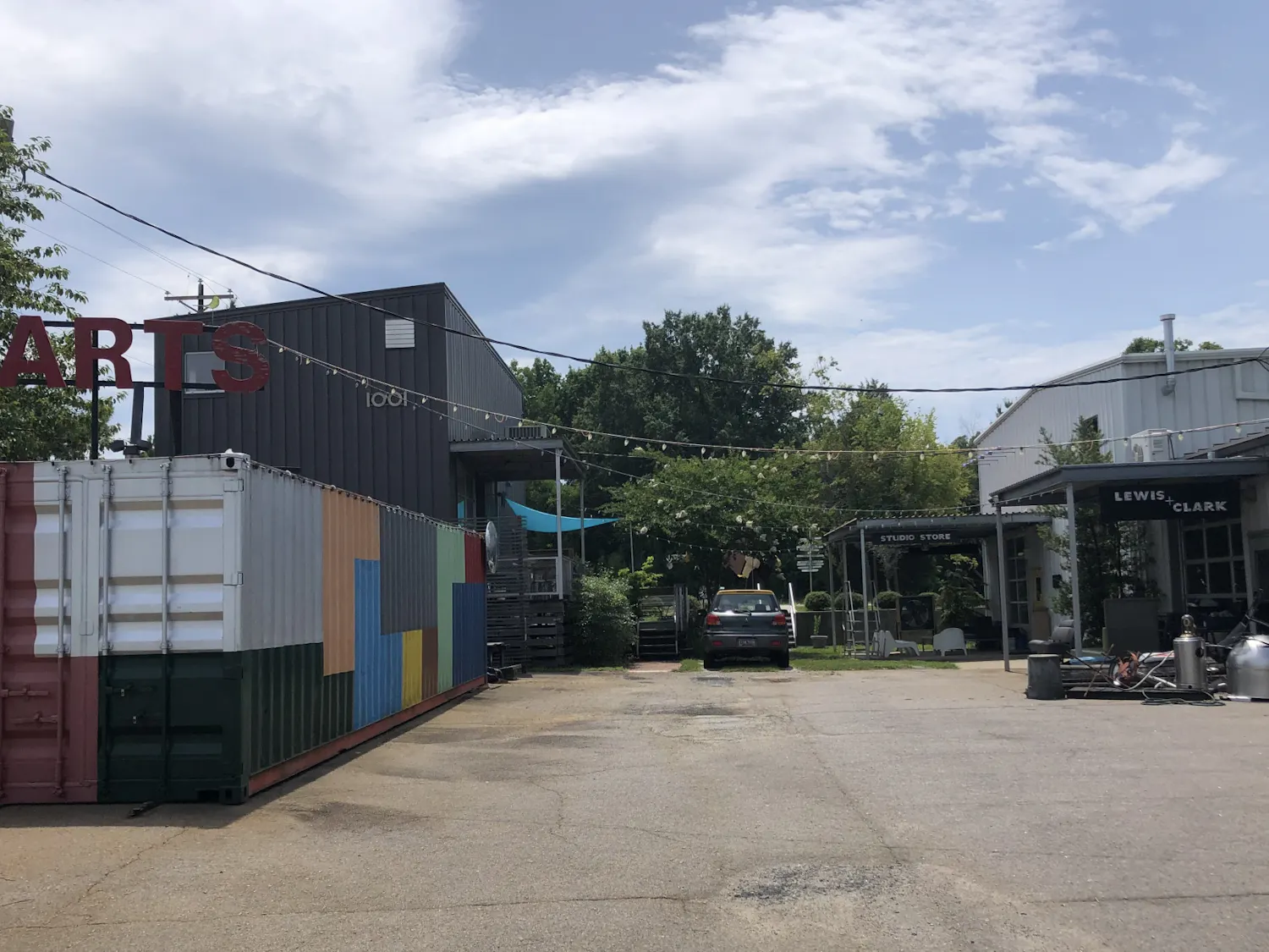 A photo of three art studios on the corner of Huger and Pendleton Street on June 21, 2021. The three art studios share the goal of providing an art district to the Vista.