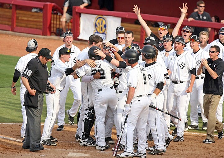 South Carolina&apos;s Max Schrock delivers a pinch-hit, game-tying two-run home run in the bottom of the ninth inning against Mississippi in the first game of a doubleheader at Carolina Stadium in Columbia, S.C., Saturday, March 15, 2014. The host Gamecocks won the opener, 5-4, in 10 innings. (Dwayne McLemore/The State/MCT)