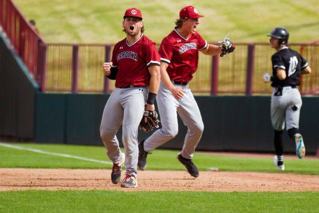 Freshman pitcher Connor McCreery is greeted by sophomore catcher/infielder Cole Messina during the first game of the 2022 Garnet and Black World Series on Nov. 2, 2022. McCreery's and Messina's Garnet team would go on to win two of the three games.