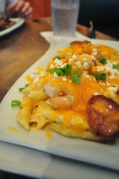 	Seafood mac-n-cheese with goat cheese, scallops, tender shrimp, and bacon shreds