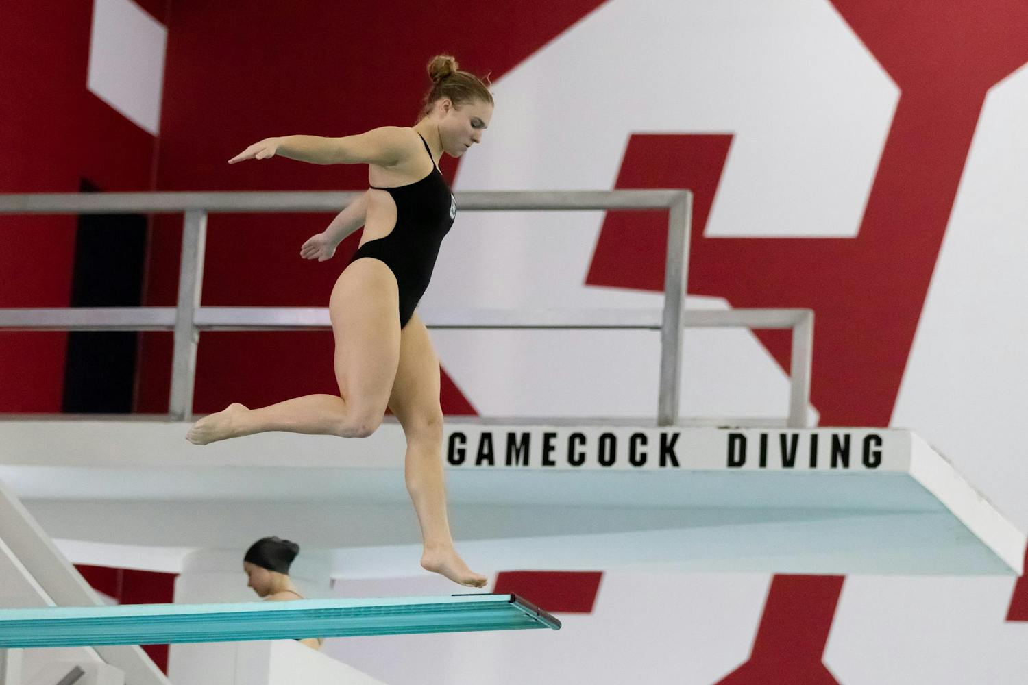 Sophie Verzyl jumps off the diving board during the South Carolina vs. Davidson meet on Jan. 21, 2023. Verzyl finished in second place with a total score of 358.80.