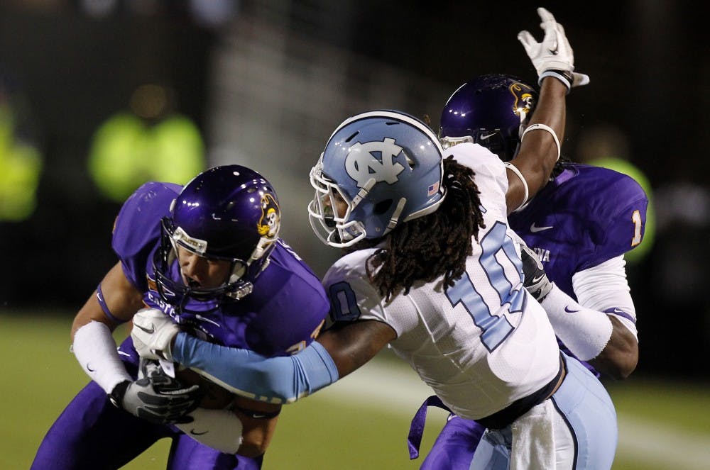 North Carolina safety Tre Boston (10) strips the ball from East Carolina wide receiver Danny Webster (33) in the first quarter on Saturday, October 31, 2011 at Dowdy-Ficklen Stadium in Greenville, North Carolina. (Chuck Liddy/Raleigh News &amp; Observer/MCT)