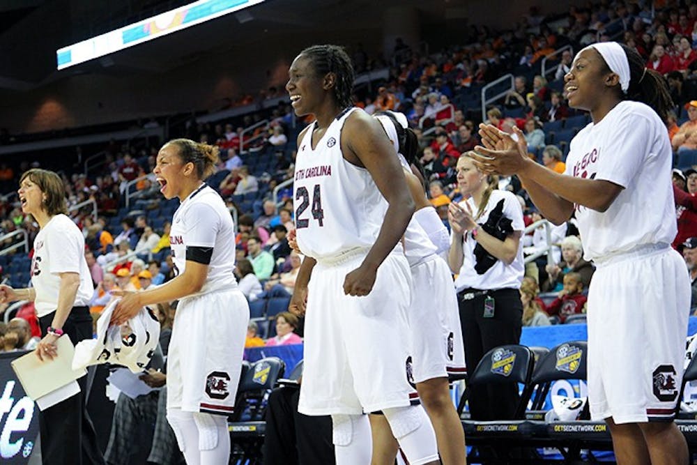 South Carolina Gamecocks celebrate after beating Georgia to advance in SEC tournament play at The Arena at Gwinnett Center, in Duluth, Ga., Friday, March 7, 2014. South Carolina won 67-48. (Tracy Glantz/The State/MCT)