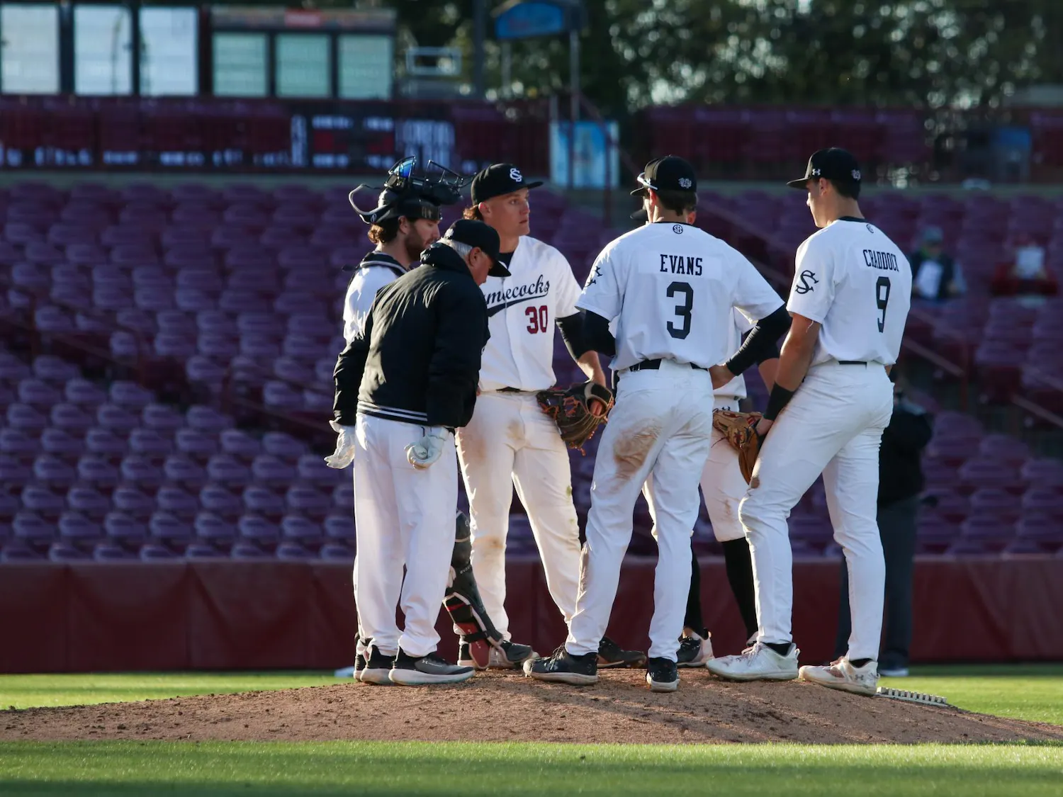 FILE — The Gamecocks meet on the pitcher’s mound with head coach Paul Mainieri to strategize for the next innings against Charlotte at Founders Park on March 17, 2026. Associate head coach and hitting coach Monte Lee has taken over as interim head coach after South Carolina parted ways with Mainieri in the 2026 season.