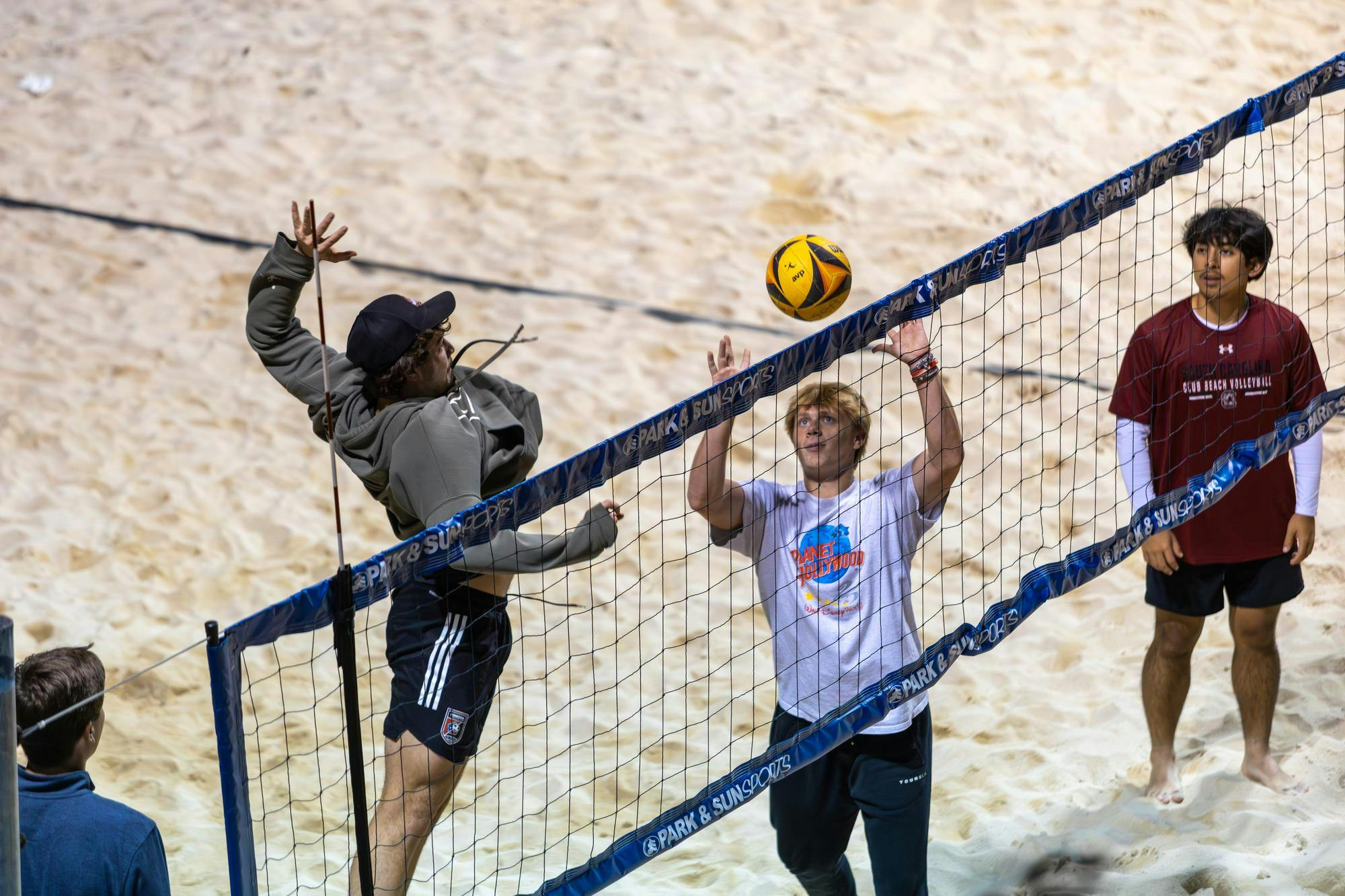 Third-year supply chain management and marketing student Wes Nickerson spikes a ball over a net during club beach volleyball practice on Nov. 6, 2025. The co-ed Gamecock club beach volleyball team travels to 3 to 4 tournaments per semester to compete against other collegiate club teams.