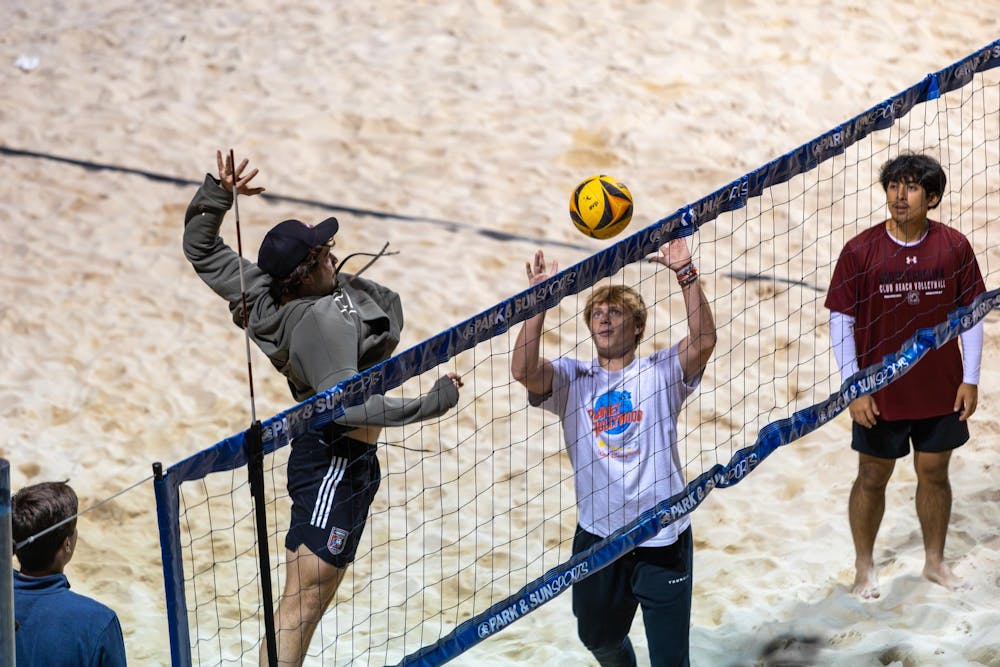 <p>Third-year supply chain management and marketing student Wes Nickerson spikes a ball over a net during club beach volleyball practice on Nov. 6, 2025. The co-ed Gamecock club beach volleyball team travels to 3 to 4 tournaments per semester to compete against other collegiate club teams.</p>