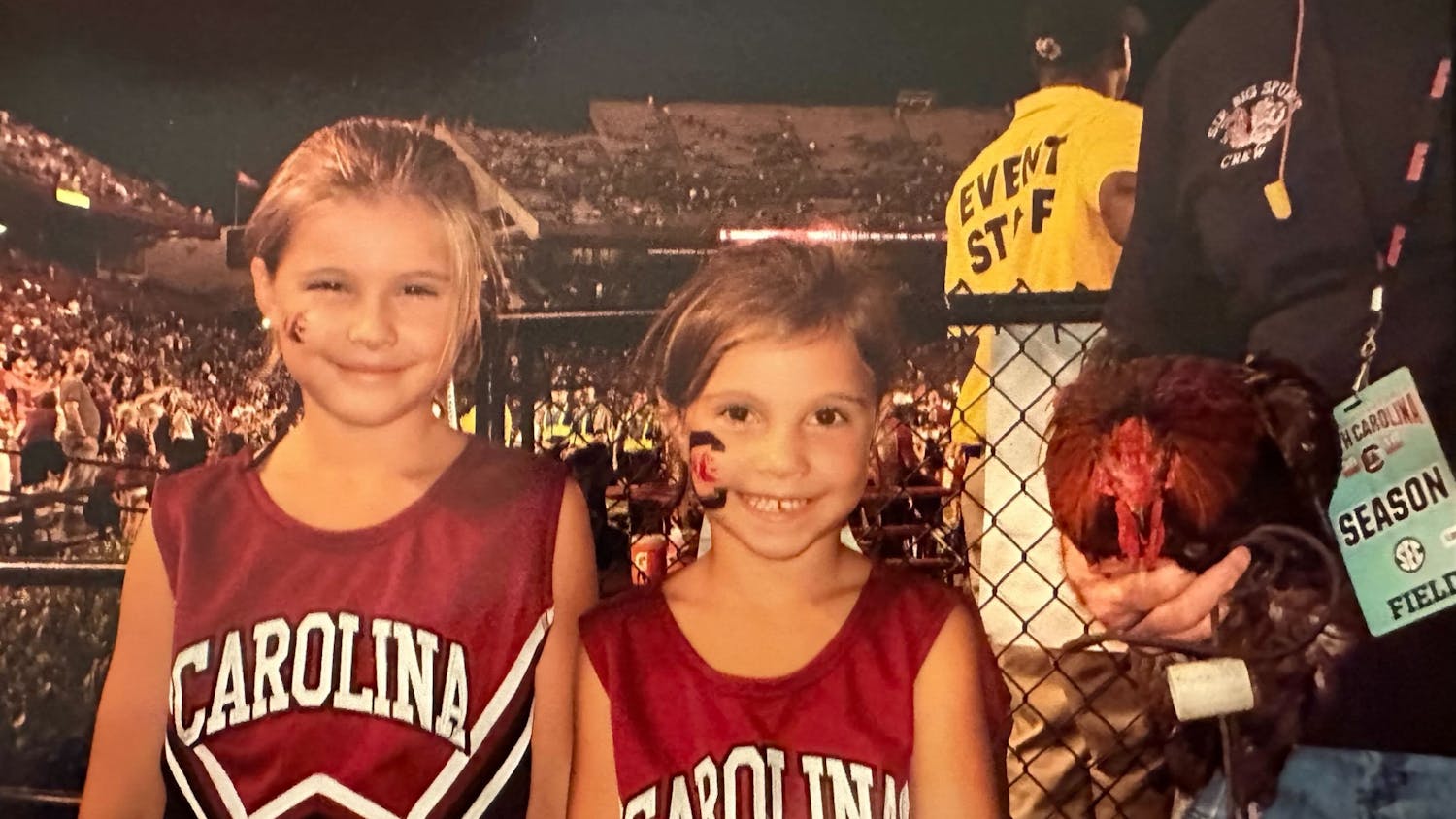 Sophia Burnett (left) and Camila Burnett (right) stand next to the field at Williams-Brice Stadium. Camila claims to be the one who convinced her sister to follow their father to his alma mater.